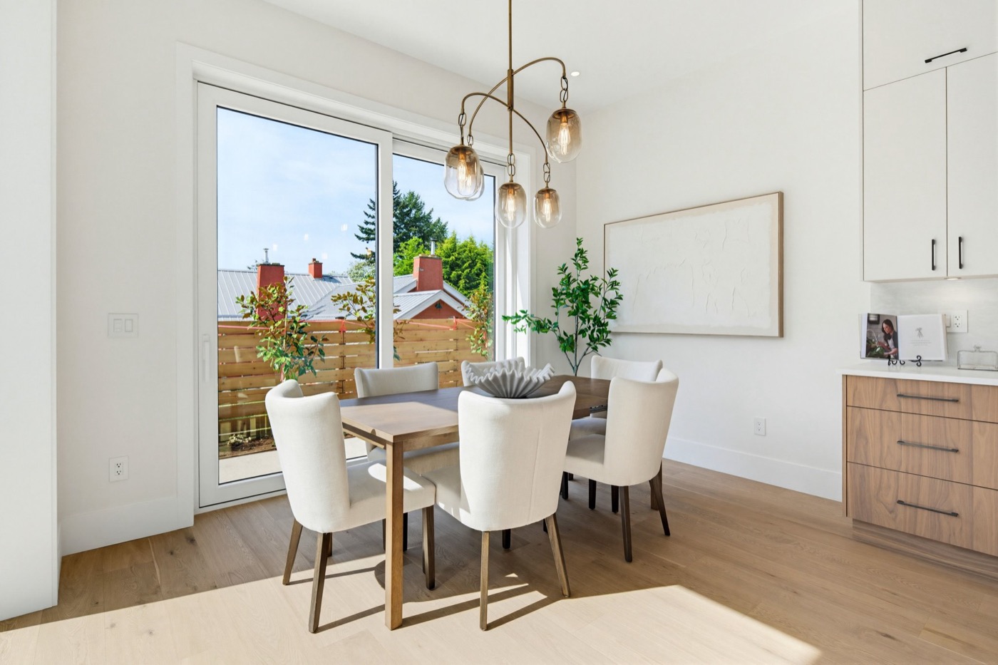 Contemporary dining room with premium lighting fixtures