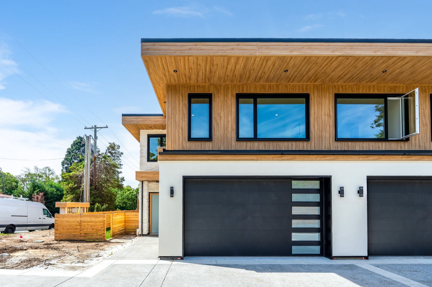 Modern townhome garage and exterior landscape