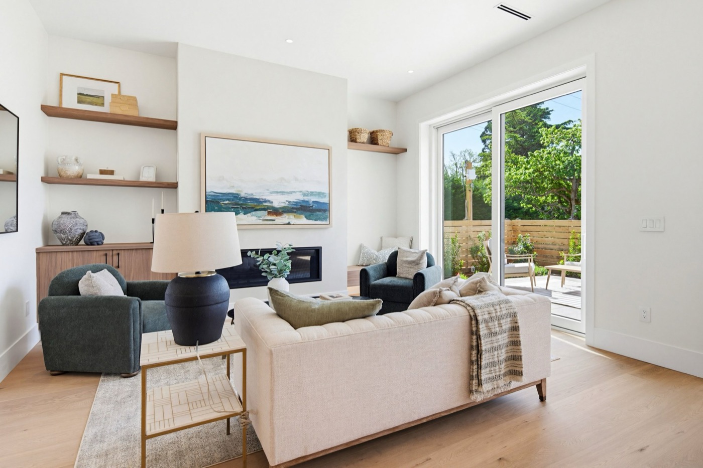 Open concept living area with large floor-to-ceiling windows