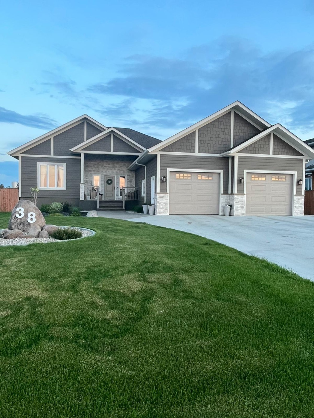 Valleyfield Estates: grey bungalow with double garage
